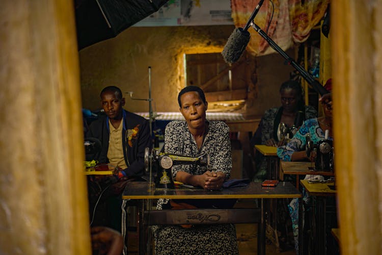 Ugandan youth working at tailoring and carpentry workshop
