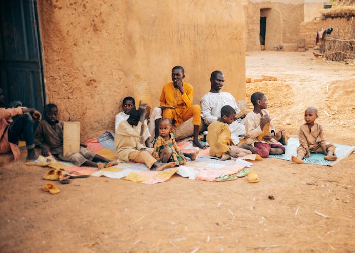 Ugandan toddlers at SHUL children day care eating and learning